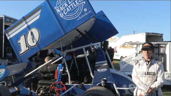 Kelly Hebing stands at her sprint car while talking to NCC News.