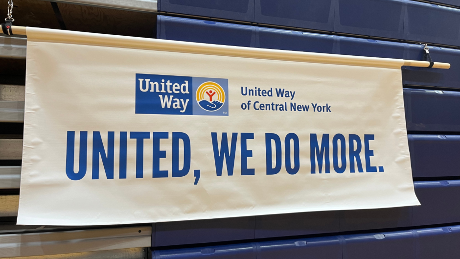 A white banner with blue lettering reads, "United Way of Central New York - UNITED, WE DO MORE."