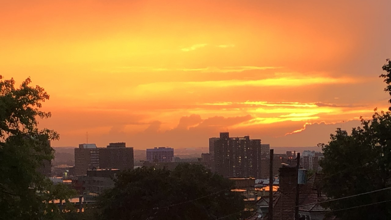 The Syracuse skyline emulates a Los Angeles sunset.