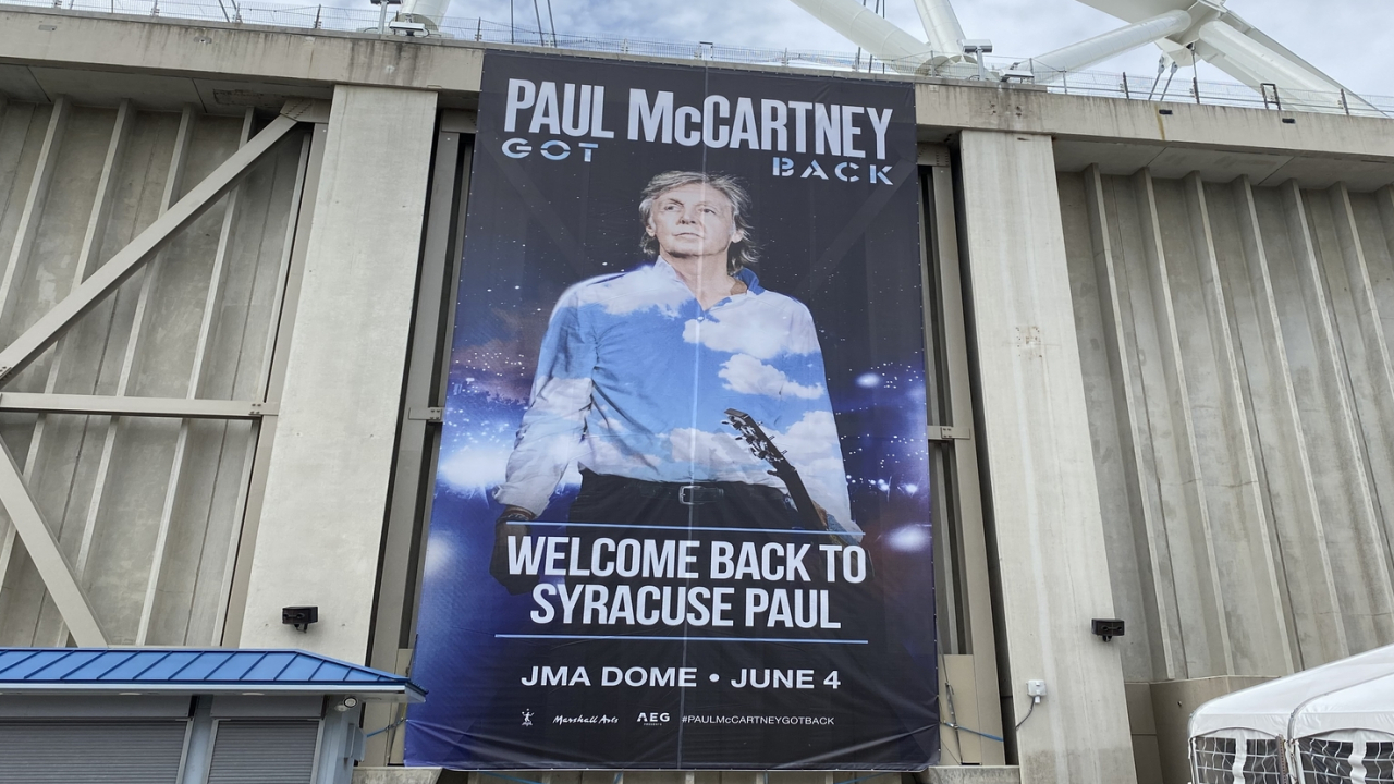 Banner of McCartney in front of JMA Wireless Dome