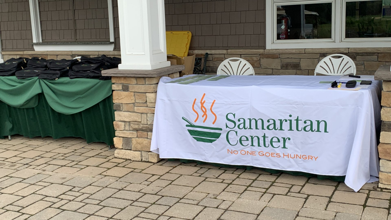 table with table cloth that says samaritan center on it.