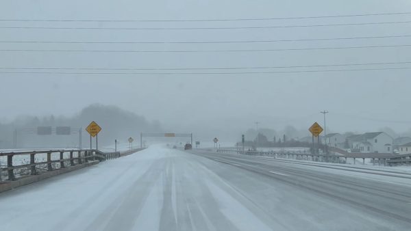 Snow covers the I-690 highway in Syracuse during a winter storm in February 2023.