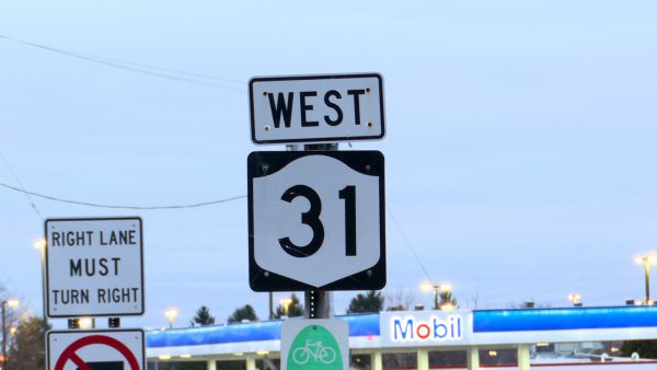 A sign on the side of the road that says 31