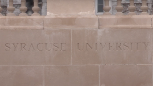 Syracuse University sign in front of the Hall of Languages