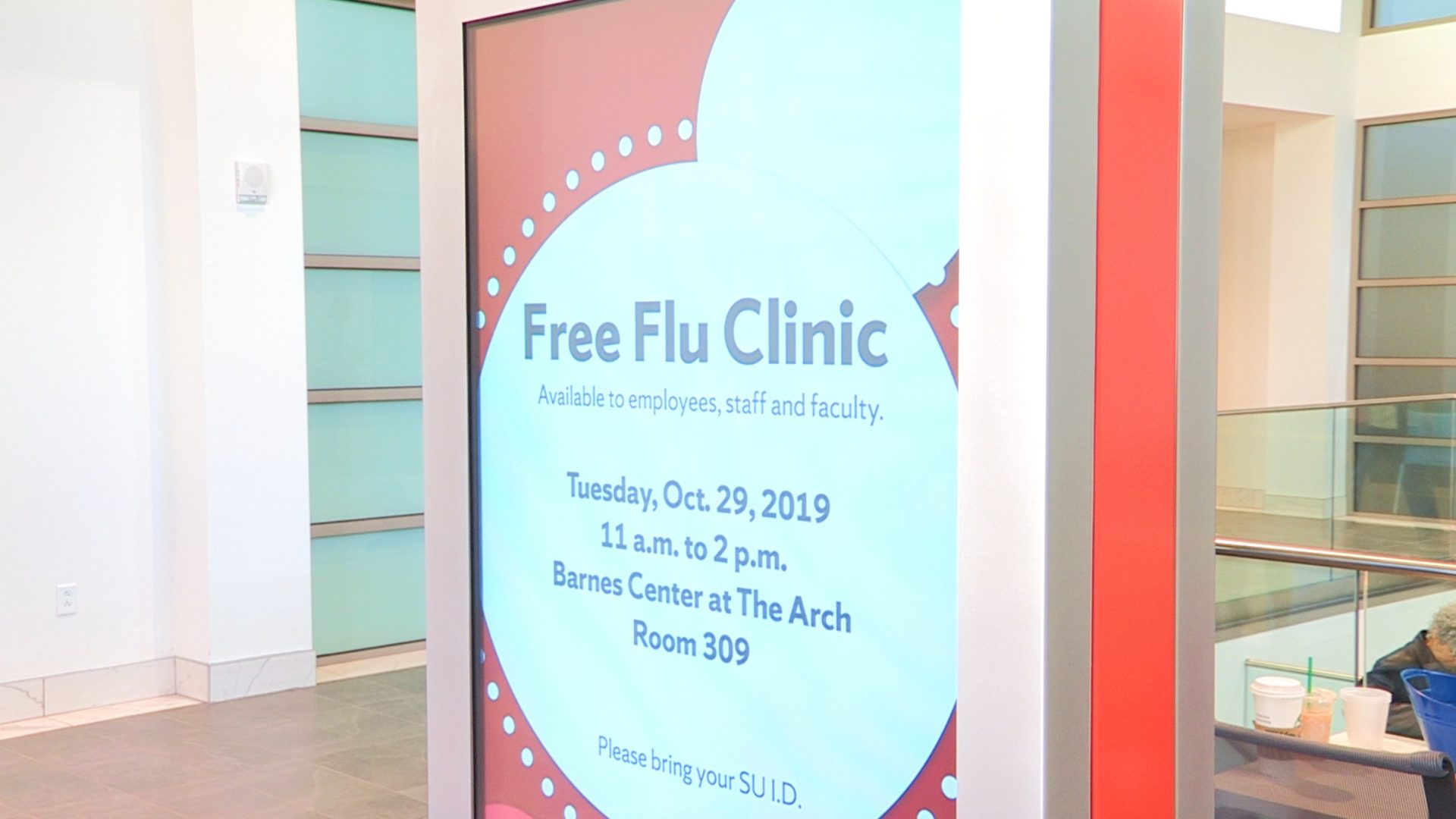 A sign at the Barnes Center promotes its free flu vaccine clinic.