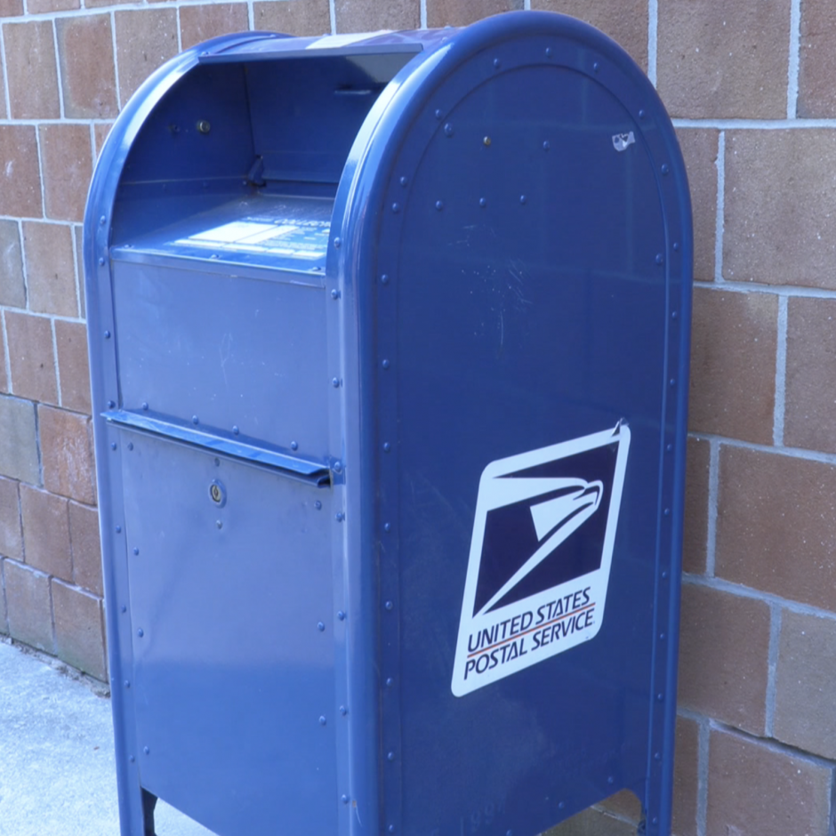 photo of a blue USPS mailbox