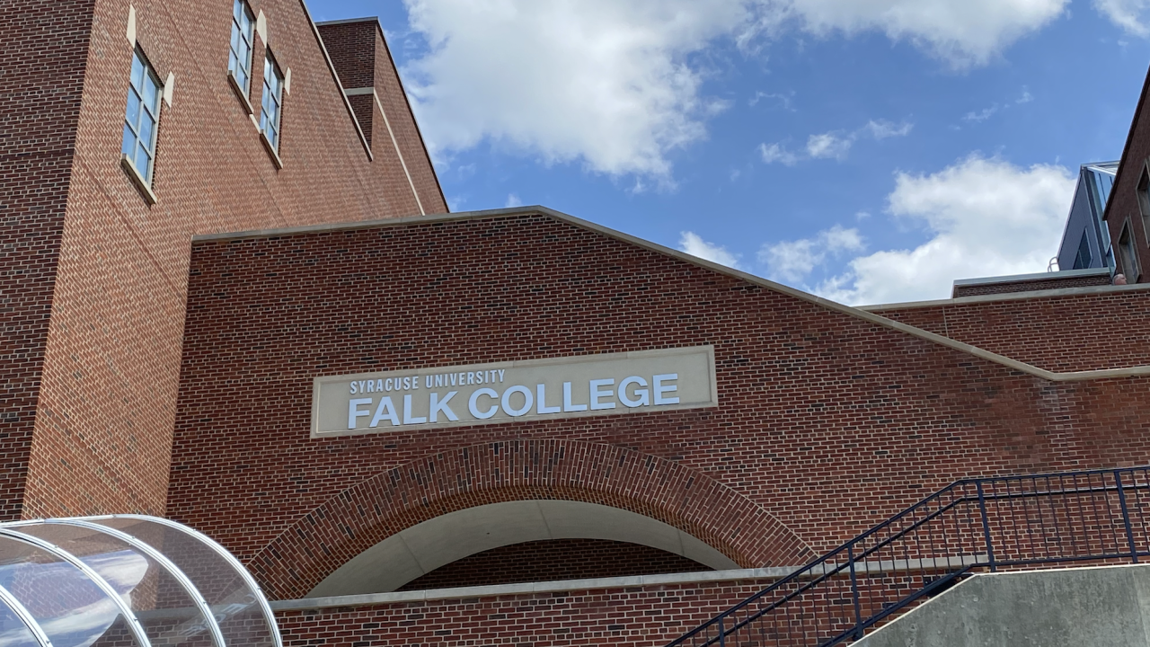 Falk College under blue skies.