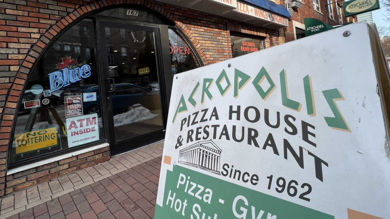 The sign outside Acropolis Pizza on Marshall Street, the longtime late night spot for a quick slice for SU students.