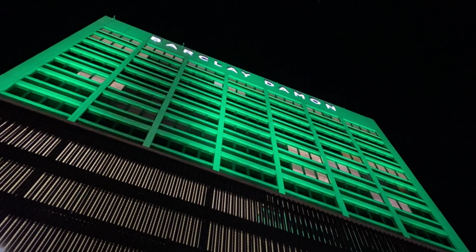 Barclay Diamond Building lit up green
