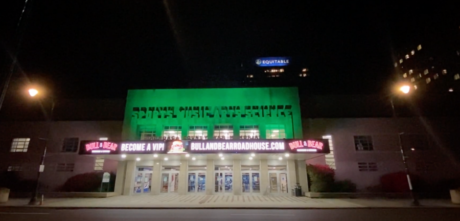 Syracuse Arts Center illuminated green
