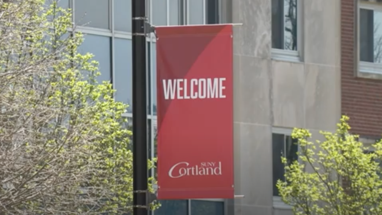 pictured is a red SUNY Cortland flag