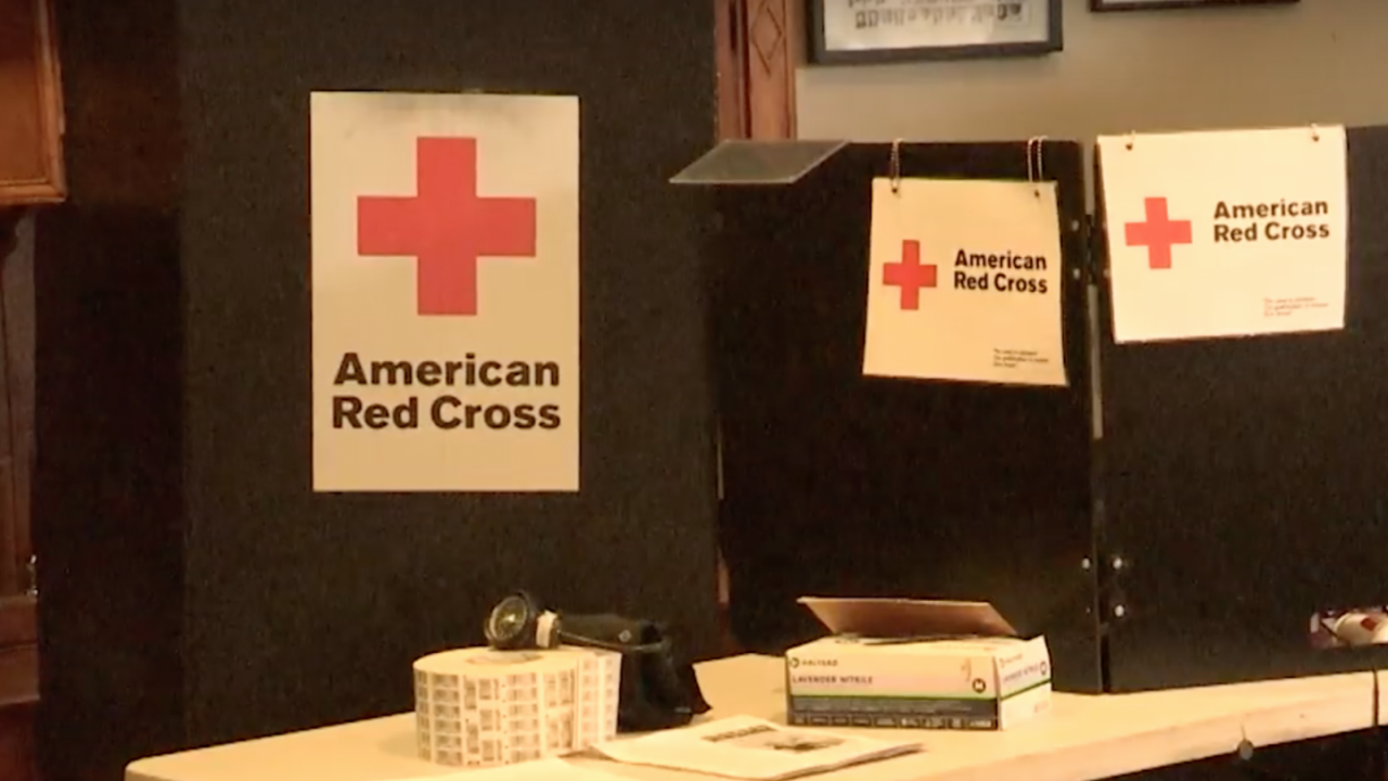 A Red Cross station is set up for a blood drive.