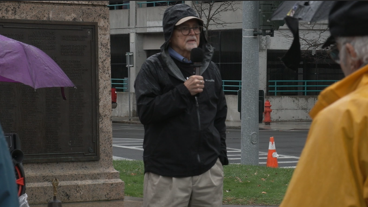 Ron Van Nostrand speaking to the crowd at the Syracuse Peace Council rally for Armistice Day