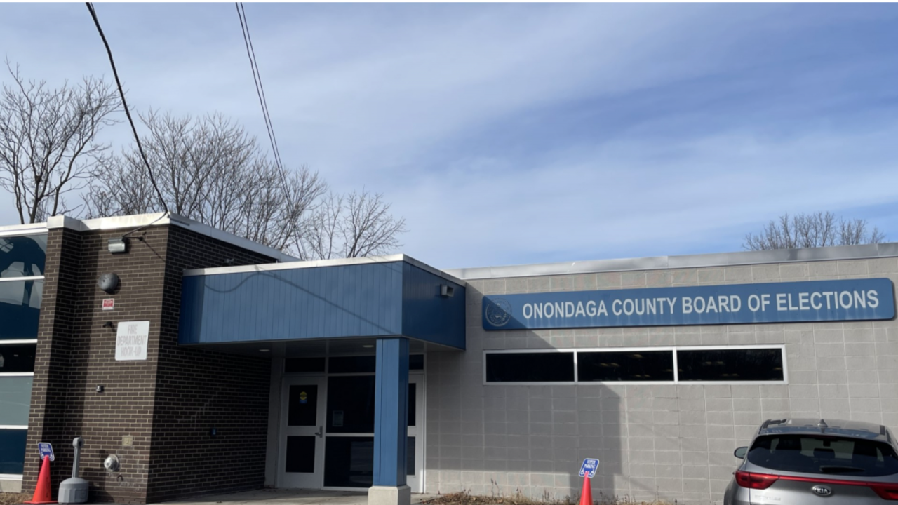 Grey building. Sign that reads "Onondaga County Board of Elections.