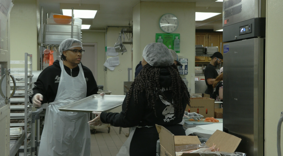 volunteer handing tray