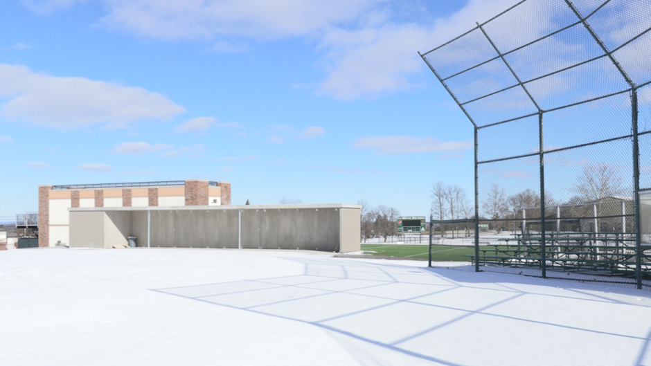 One of the new dugouts at Dick Rockwell Field sits nearly completed, while the field itself remains covered in snow.