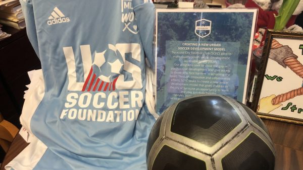 The jersey and soccer ball that the YWCA gives to each of their campers.