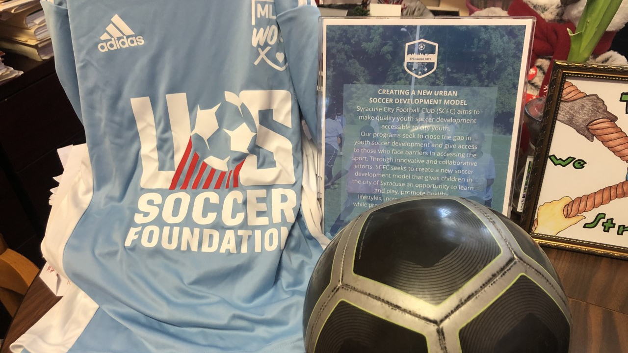 The jersey and soccer ball that the YWCA gives to all of their campers.
