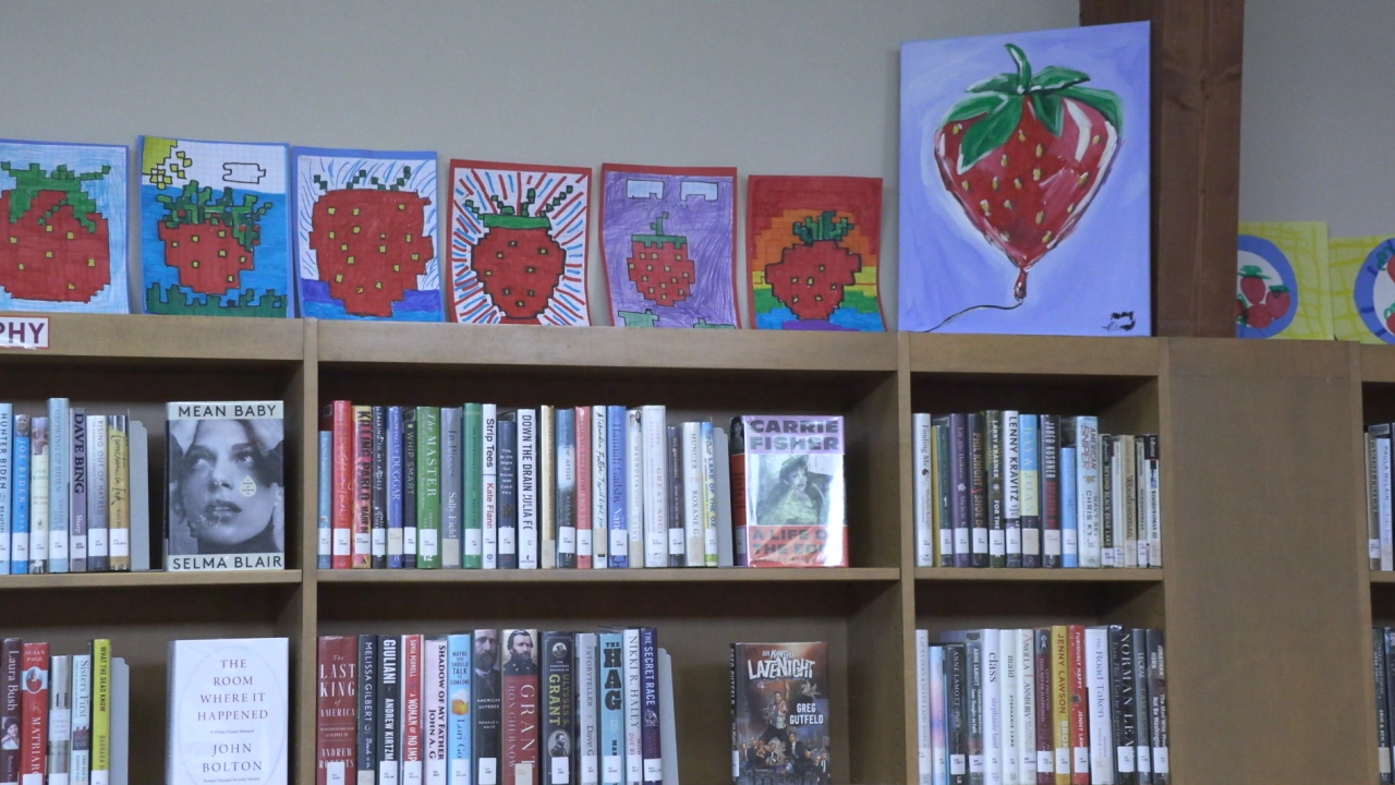 Strawberry artwork lines the children's section at the Betts Branch Library in Syracuse.