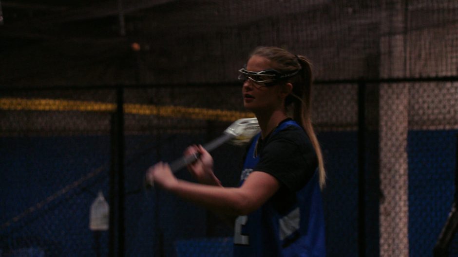 Tori playing lacrosse.