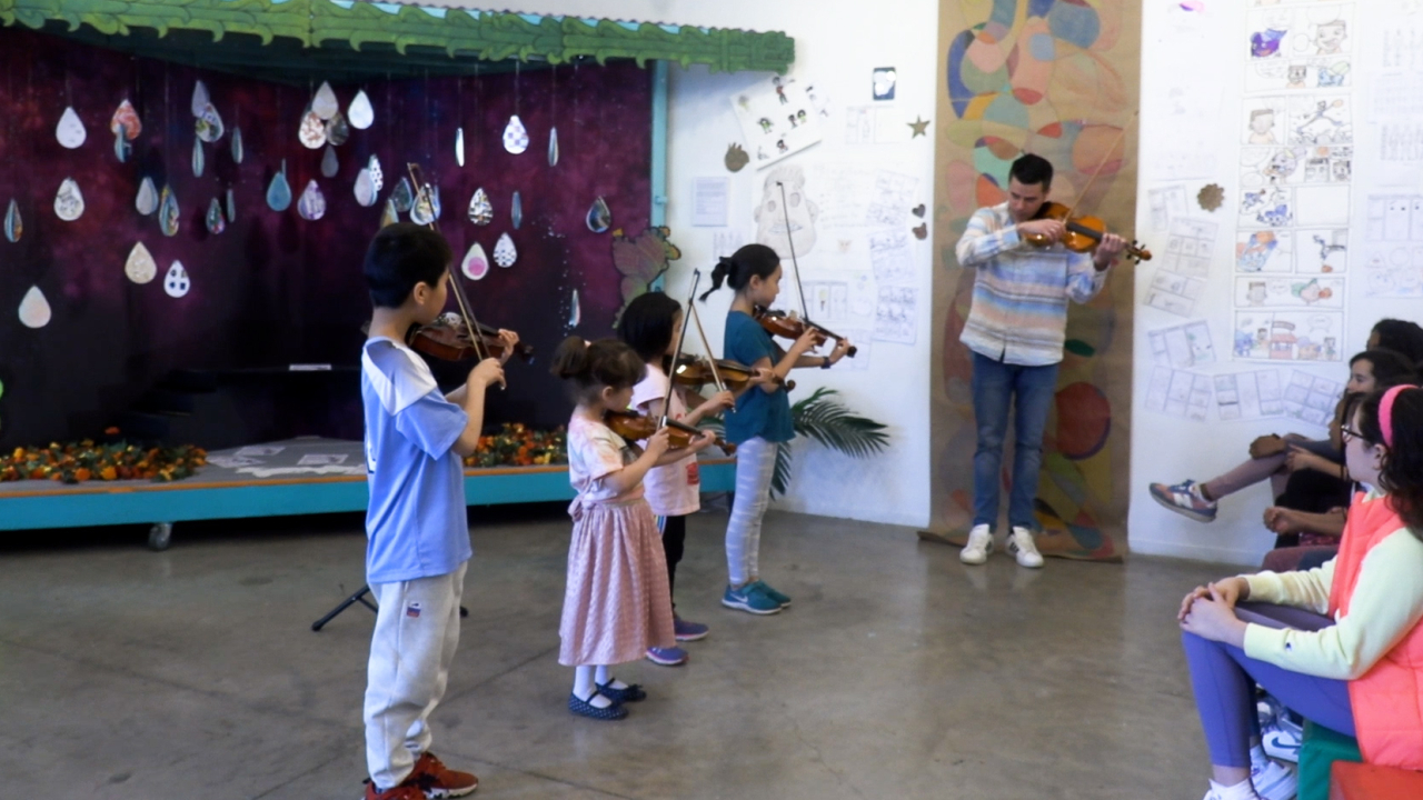 Students playing violin.