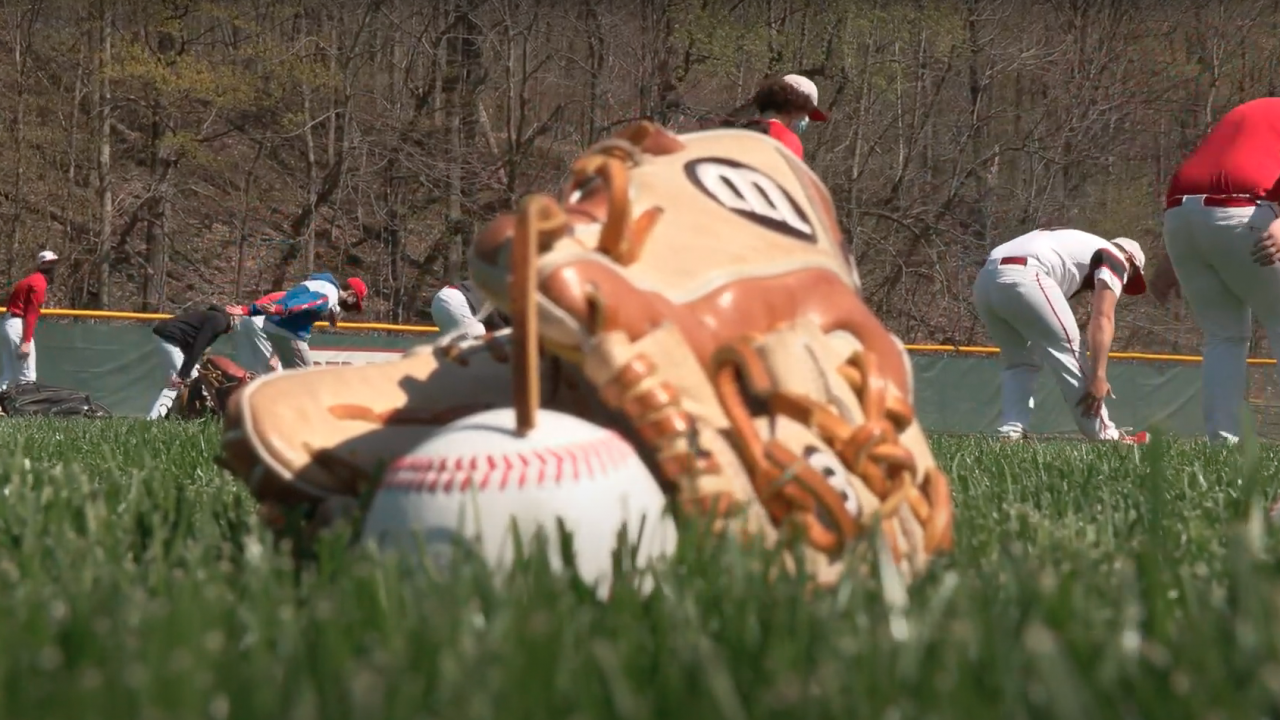 Glove on the Jamesville-DeWitt Baseball field as the team warms up behind it.