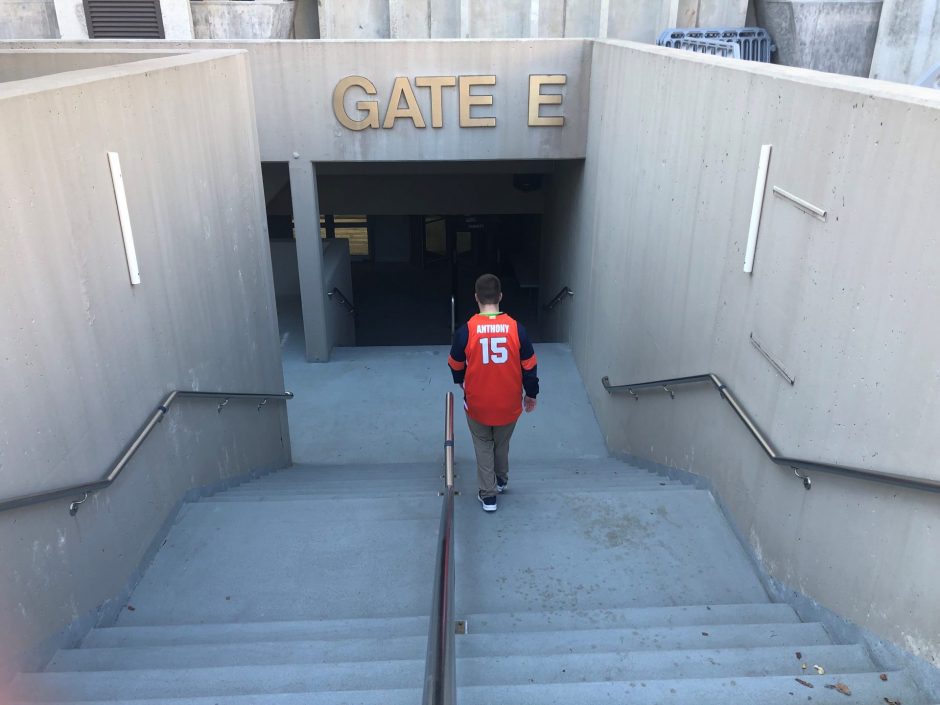 Samuels walks down steps of Gate E at the Carrier Dome.