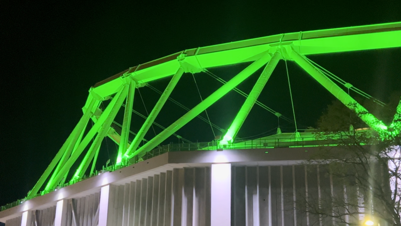 The JMA Dome illuminated with green lights