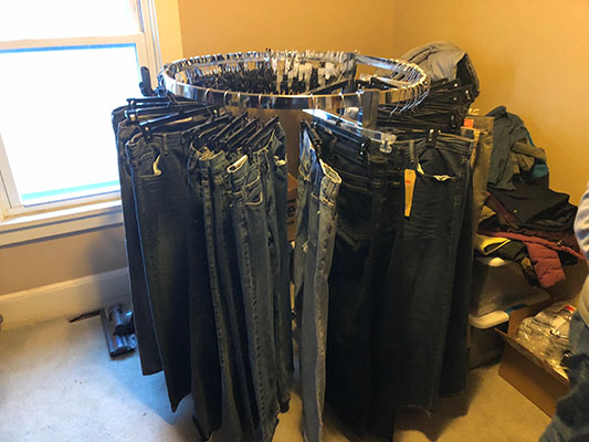 Rack of blue jeans to give out to the homeless
