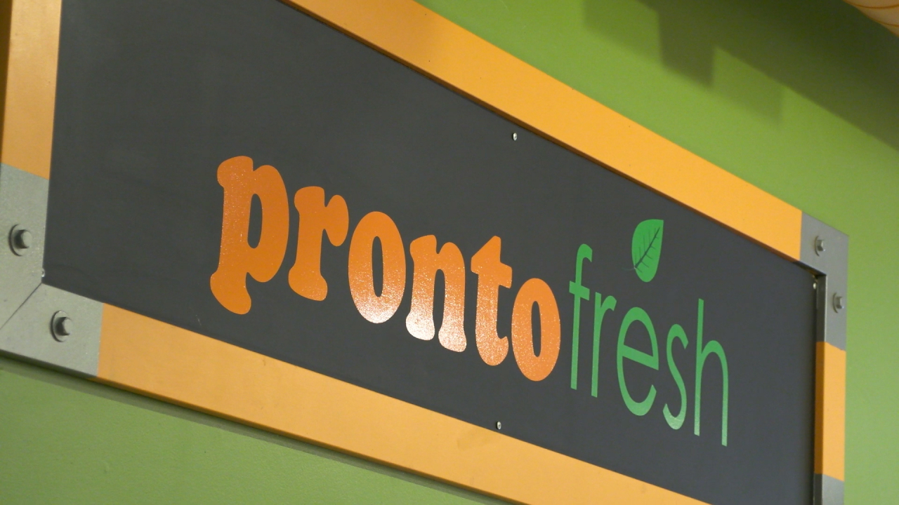 A Pronto Fresh sign in the store.