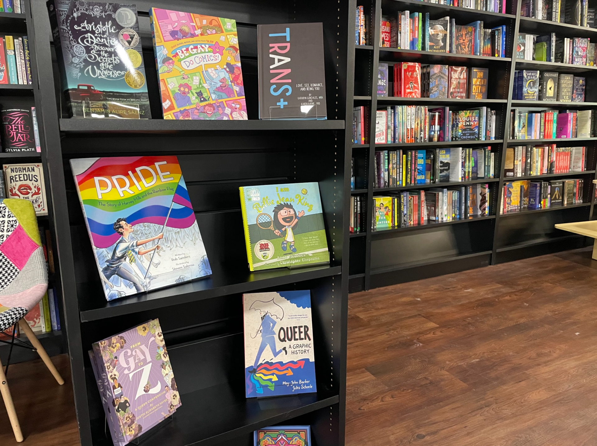 Books highlighting Pride and the LGBTQ+ community are displayed in a new bookstore, Parthenon Books.