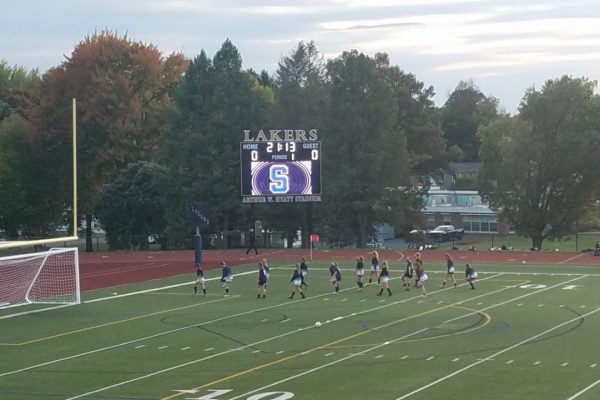 The Skaneateles High School girls soccer team warms up before their first game of the 2020 season.