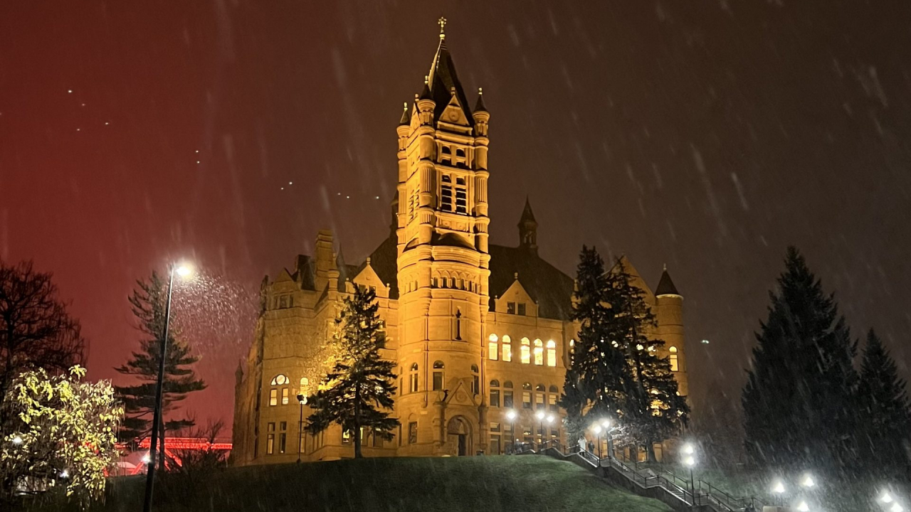 Snow falls over Crouse hill at Syracuse Univesity