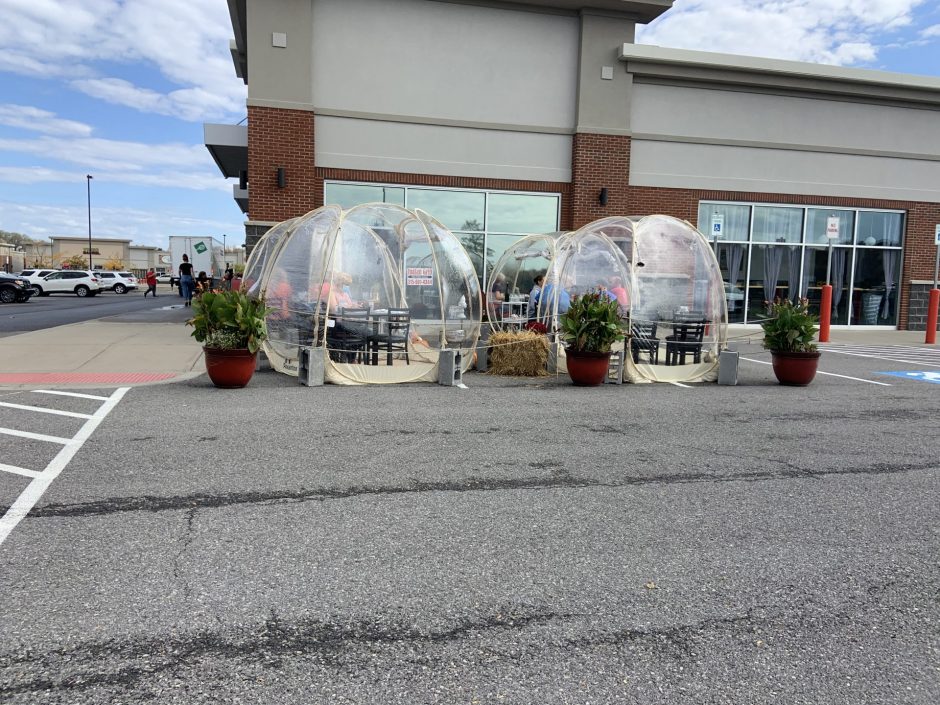 Dining pods are set up in the parking lot of the restaurant the Brasserie Bar and Bistro.
