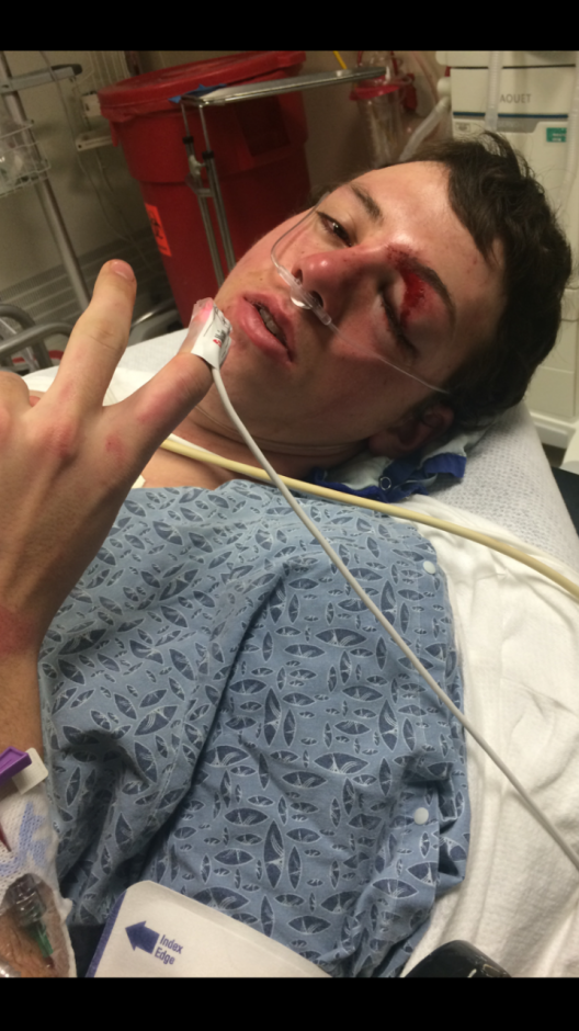 Grayson Betts lies in a hospital bed with severe injuries from his snowmobile accident. 
