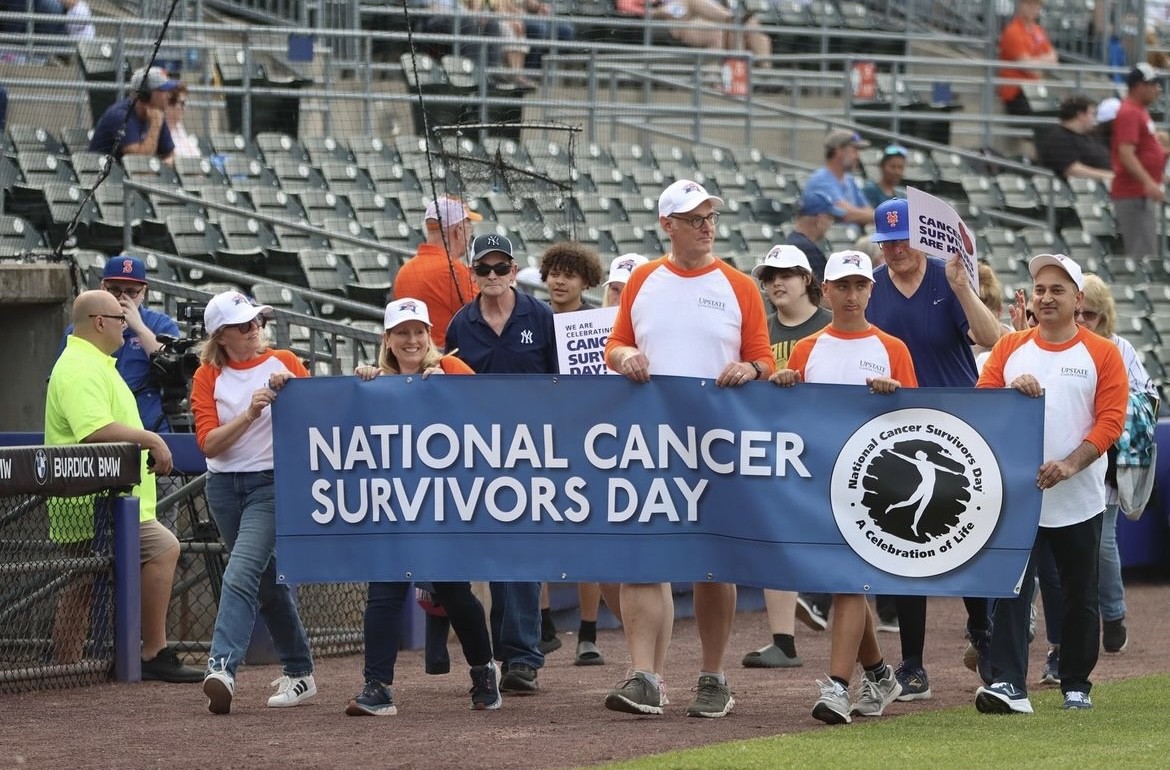 Upstate Medical Volunteers and Cancer Survivors Walking the Pregame Parade on National Cancer Survivor Day