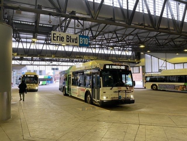 Centro bus waits to depart S Salina St. hub.