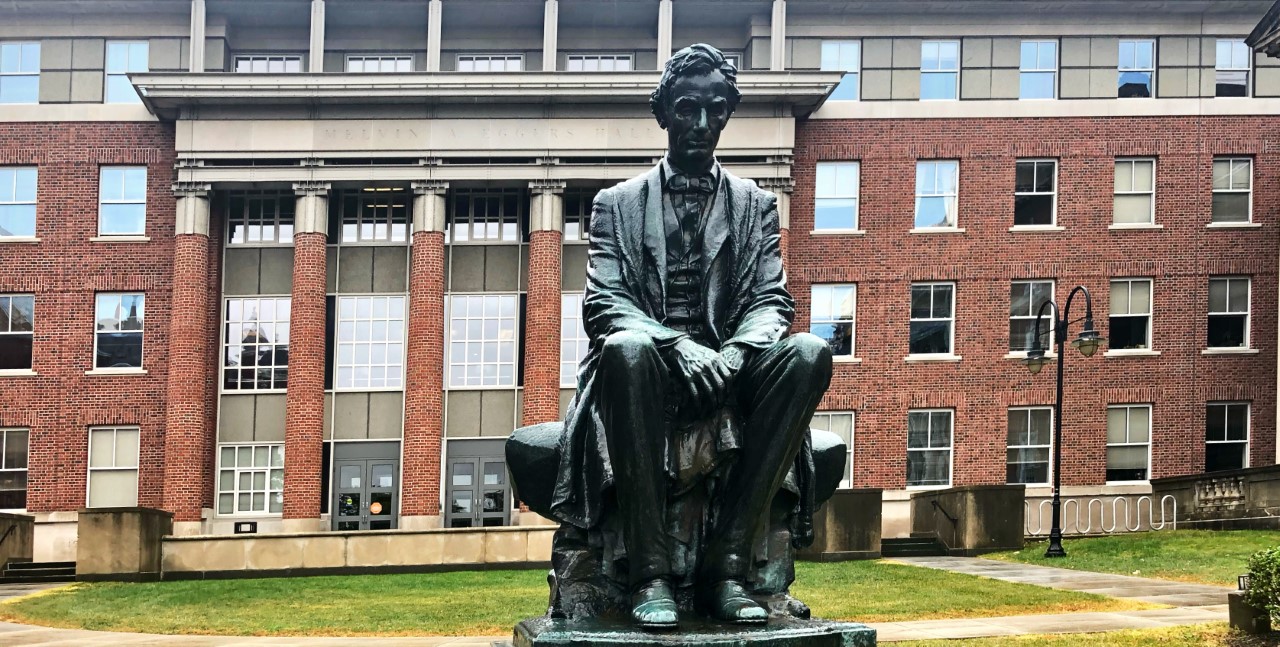 A sculpture of Abraham Lincoln in the lawn of the Maxwell School of Citizenship and Public Affairs at Syracuse University.