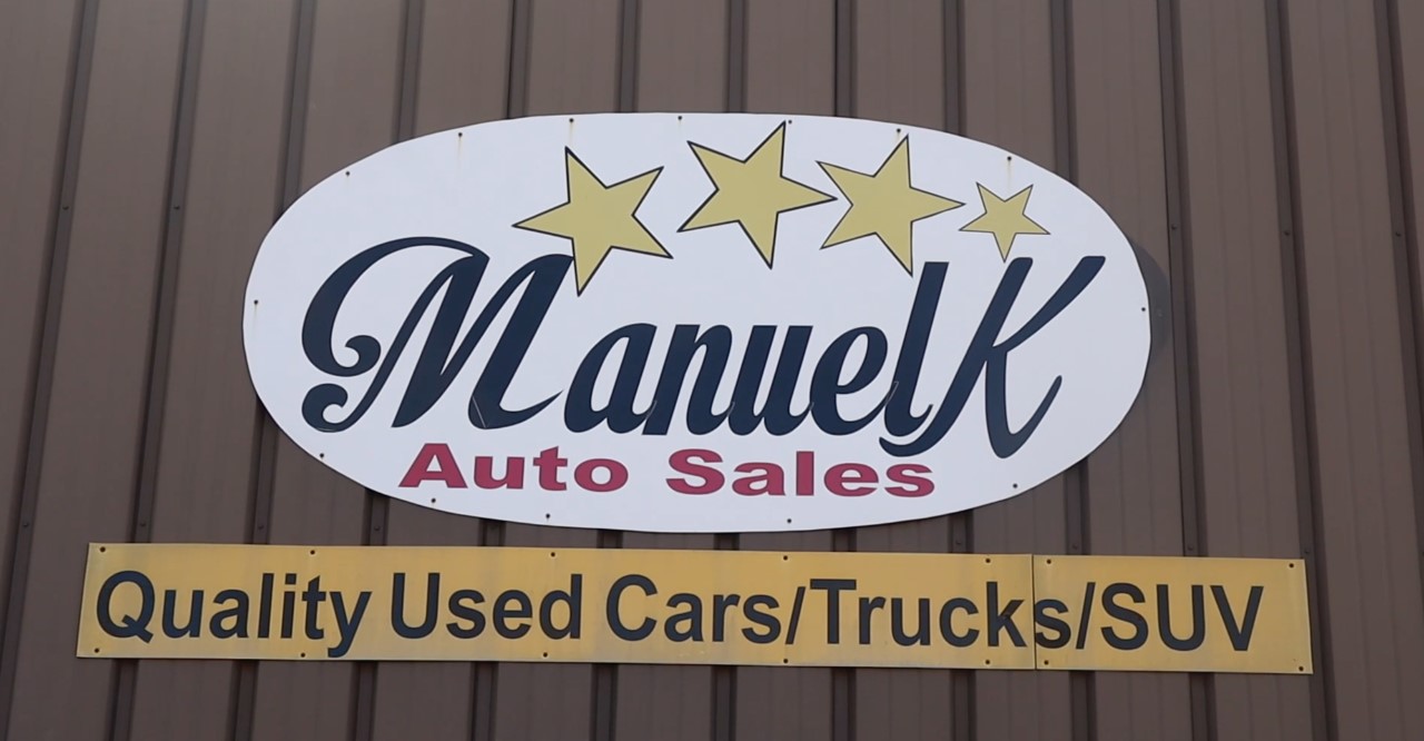Manuel K Auto Sales sits waiting for new customers during a Friday morning.
