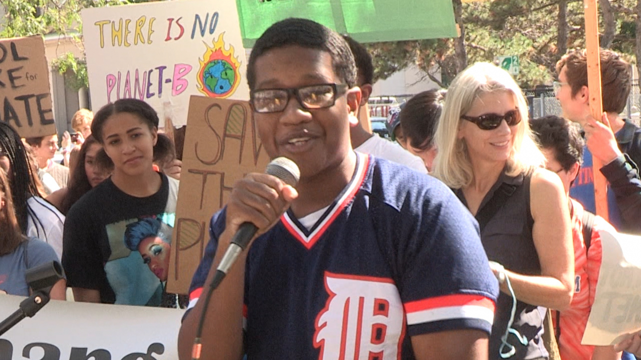 Truth Speaker performs at the climate strike in Forman Park