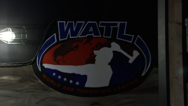 The WATL logo is hung on a wall